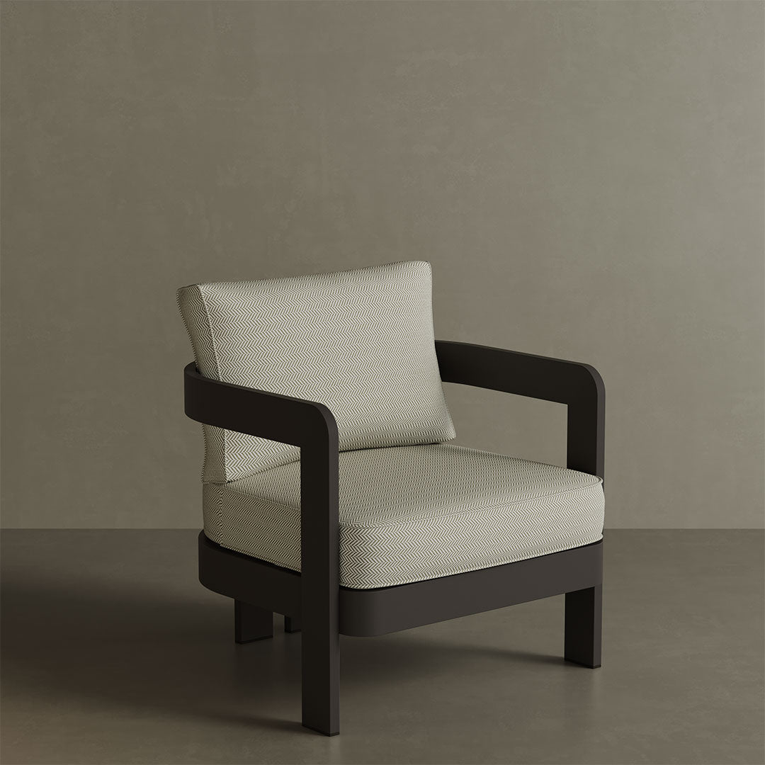 N3 Kohl Pearl Herringbone lounge chair, featuring soft, durable fabric in a refined pearl colour with a classic herringbone pattern. The chair is supported by a sleek aluminium frame, offering a stylish and comfortable design that suits both indoor and outdoor spaces.