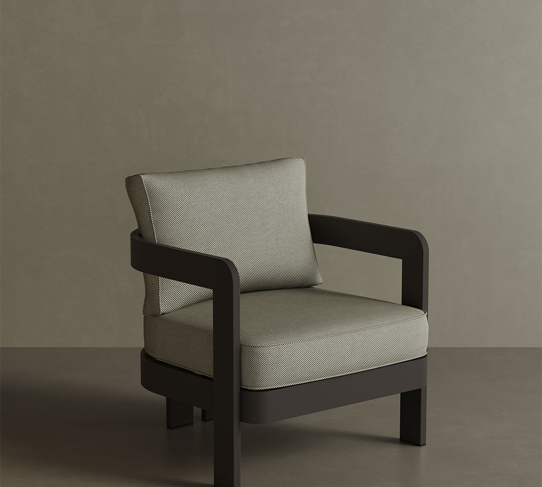 N3 Kohl Sage Twill lounge chair, featuring soft, durable fabric in a soothing sage green colour. The chair is supported by a sleek aluminium frame, offering a contemporary design that combines comfort, style, and versatility for both indoor and outdoor spaces.