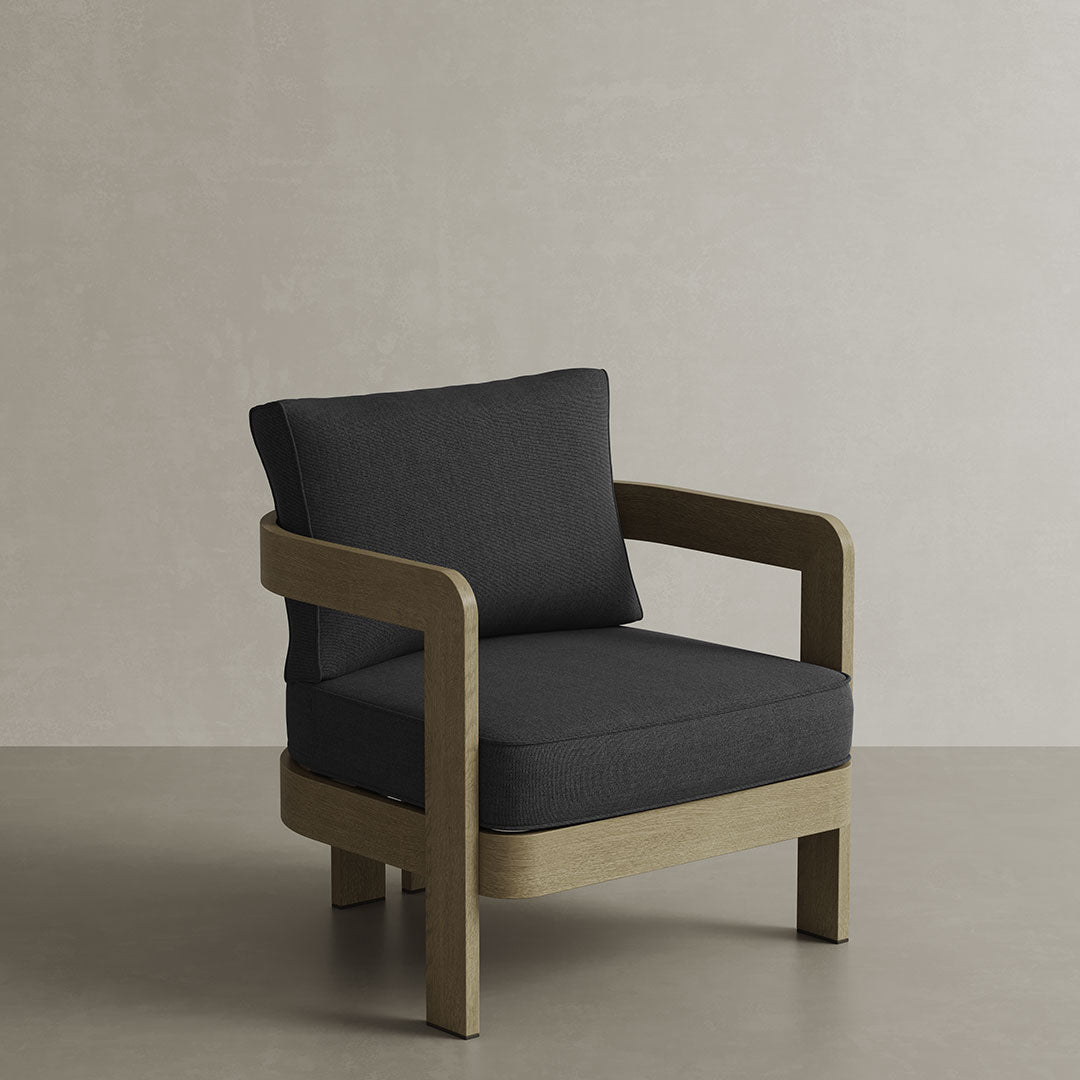 N3 Lounge Chair in Shadow Canvas, featuring soft, durable fabric in a deep, neutral shadow colour. The chair is supported by a sleek aluminium frame, offering a modern design that combines comfort, elegance, and versatility for both indoor and outdoor use.