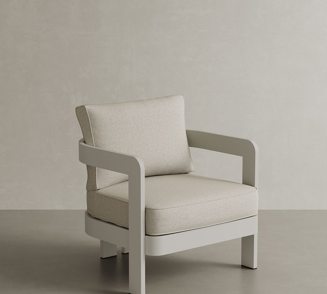 N3 Stone Bone canvas lounge chair, featuring soft, durable fabric in a refined stone bone colour. The chair is supported by a sleek aluminium frame, blending modern design with comfort and style, ideal for both indoor and outdoor settings.