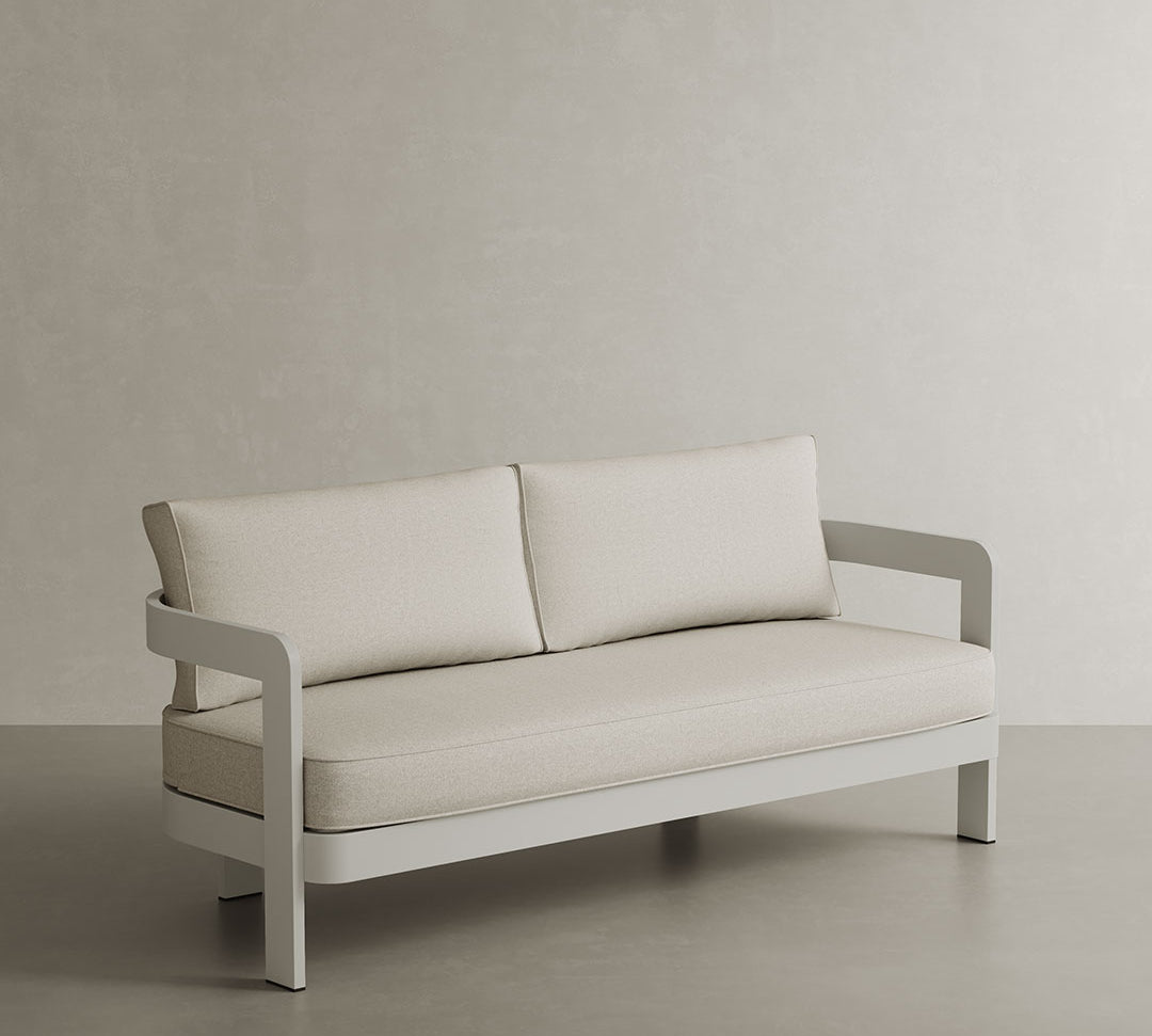 A stylish N3 three-seater sofa in Bone Canvas, featuring soft, durable fabric with a subtle, neutral tone. The modern design and clean lines make it a versatile and elegant addition to any space, offering both comfort and a sophisticated look. Perfect for enhancing both indoor and outdoor settings.