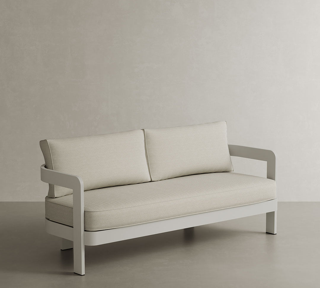 A sophisticated N3 three-seater sofa in Stone Pearl Herringbone, featuring soft, durable fabric with a delicate herringbone pattern. The sleek aluminium frame provides modern durability and elegance. Its neutral stone colour and contemporary design make it a versatile, refined addition to any outdoor or indoor space, offering both comfort and style.