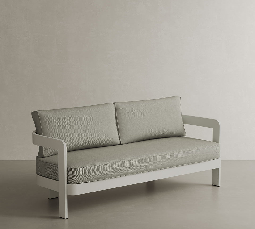 A refined N3 three-seater sofa in Stone Sage Twill, featuring soft, durable fabric with a blend of subtle stone and sage hues. The sleek aluminium frame adds a modern touch, ensuring both durability and elegance. Its neutral colour and contemporary design make it a versatile and sophisticated addition to any outdoor or indoor space.