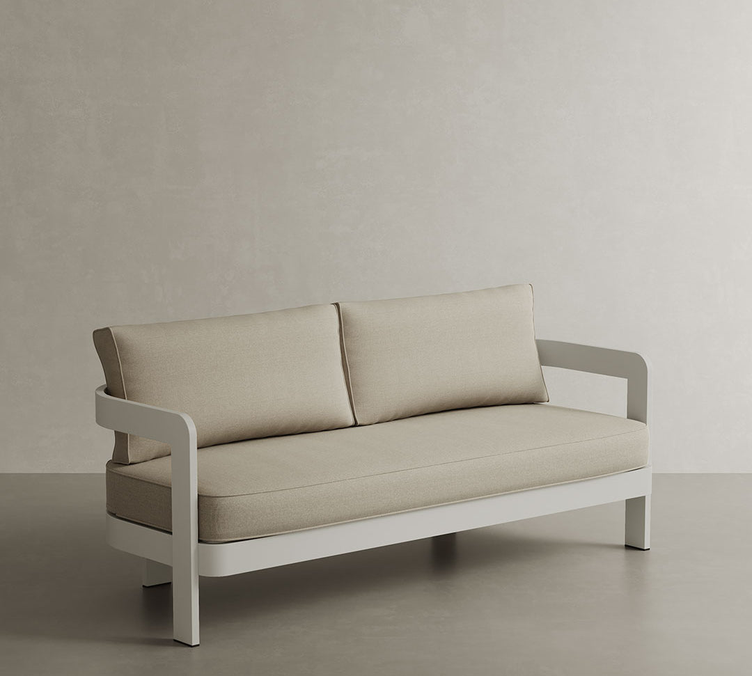 A modern N3 three-seater sofa in Stone Sand canvas, featuring soft, durable fabric and a sleek aluminium frame. The sofa’s neutral stone colour and contemporary design create a refined, versatile look, making it a perfect addition to any outdoor space, offering both comfort and timeless style.