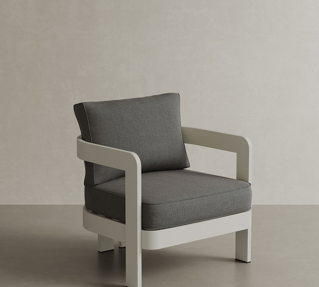 A refined N3 Stone Smoke Weave lounge chair, featuring soft, durable fabric with a subtle smoke weave pattern. The chair's modern design and sturdy frame provide both comfort and style, making it an ideal addition to any outdoor or indoor lounge area. Its neutral stone colour adds sophistication and versatility to the space.