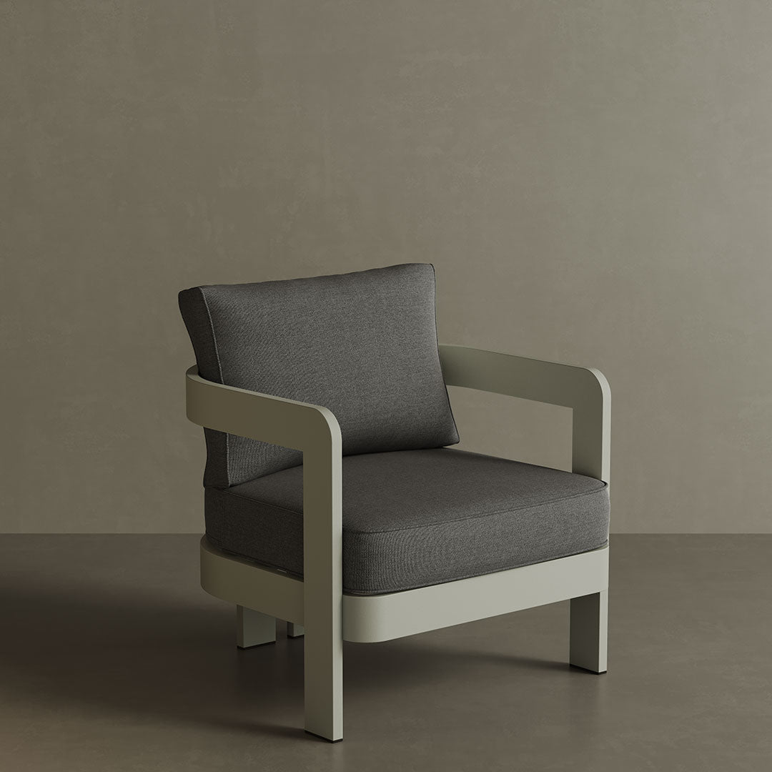 A stylish N3 Taupe Smoke Weave lounge chair, featuring soft, durable fabric with a refined smoke weave pattern. The sleek design and sturdy frame offer both comfort and contemporary elegance, making it a perfect addition to any outdoor or indoor lounge space. Its warm taupe colour adds a sophisticated touch to the overall aesthetic.