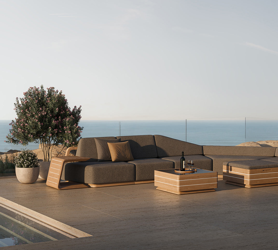 N6 dark corner sofa with coffee table lifestyle image of luxury outdoor living