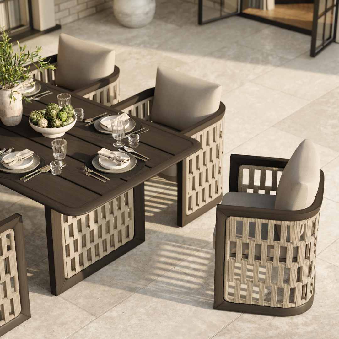N2 dark teak outdoor furniture with modern rattan rope detail in luxury property with outdoor dining table set