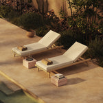 N1 light teak sun loungers and red travertine side tables