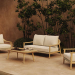 N1 light teak two seater outdoor sofa and coffee table