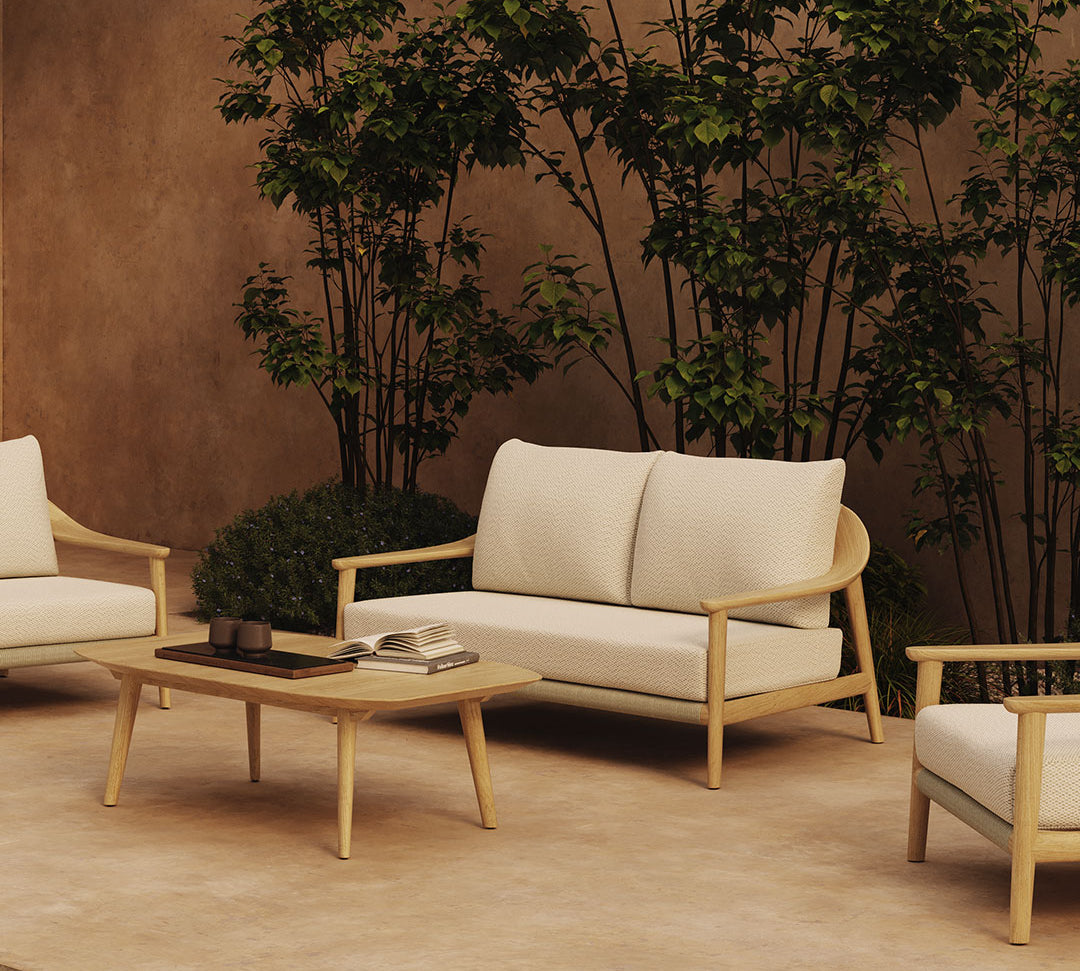 N1 light teak two seater outdoor sofa and coffee table