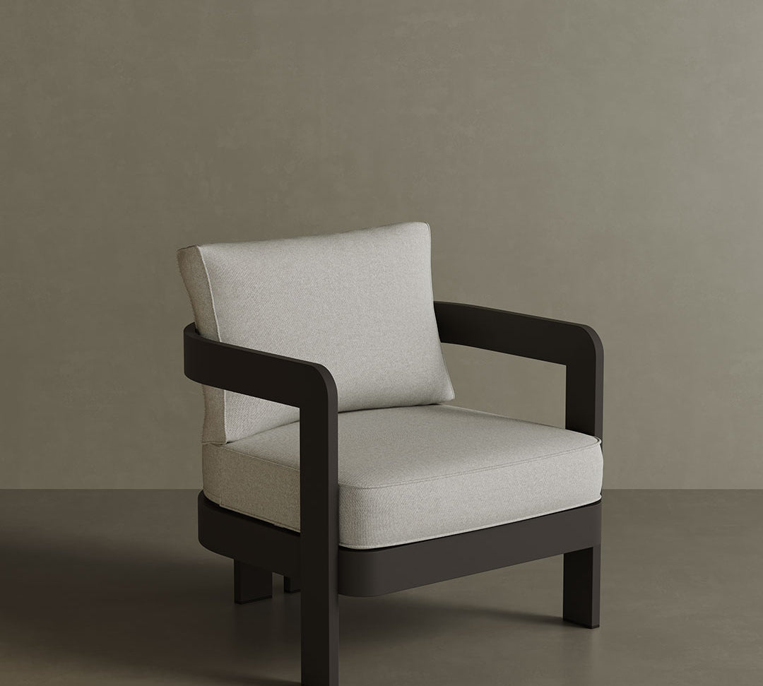 N3 Kohl Bone canvas lounge chair, featuring soft, durable fabric in a neutral bone colour. The chair is supported by a sleek aluminium frame, combining modern design with comfort and style, perfect for both indoor and outdoor settings.