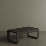 A luxury, kohl-coloured aluminium outdoor table with a modern, dark aesthetic. Featuring clean lines and a smooth matte finish, this sleek table exudes sophistication and contemporary style. Its sturdy yet lightweight design makes it the perfect addition to any chic, outdoor dining or lounge space.