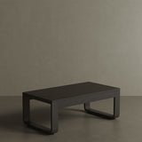 A luxury, kohl-coloured aluminium outdoor table with a modern, dark aesthetic. Featuring clean lines and a smooth matte finish, this sleek table exudes sophistication and contemporary style. Its sturdy yet lightweight design makes it the perfect addition to any chic, outdoor dining or lounge space.