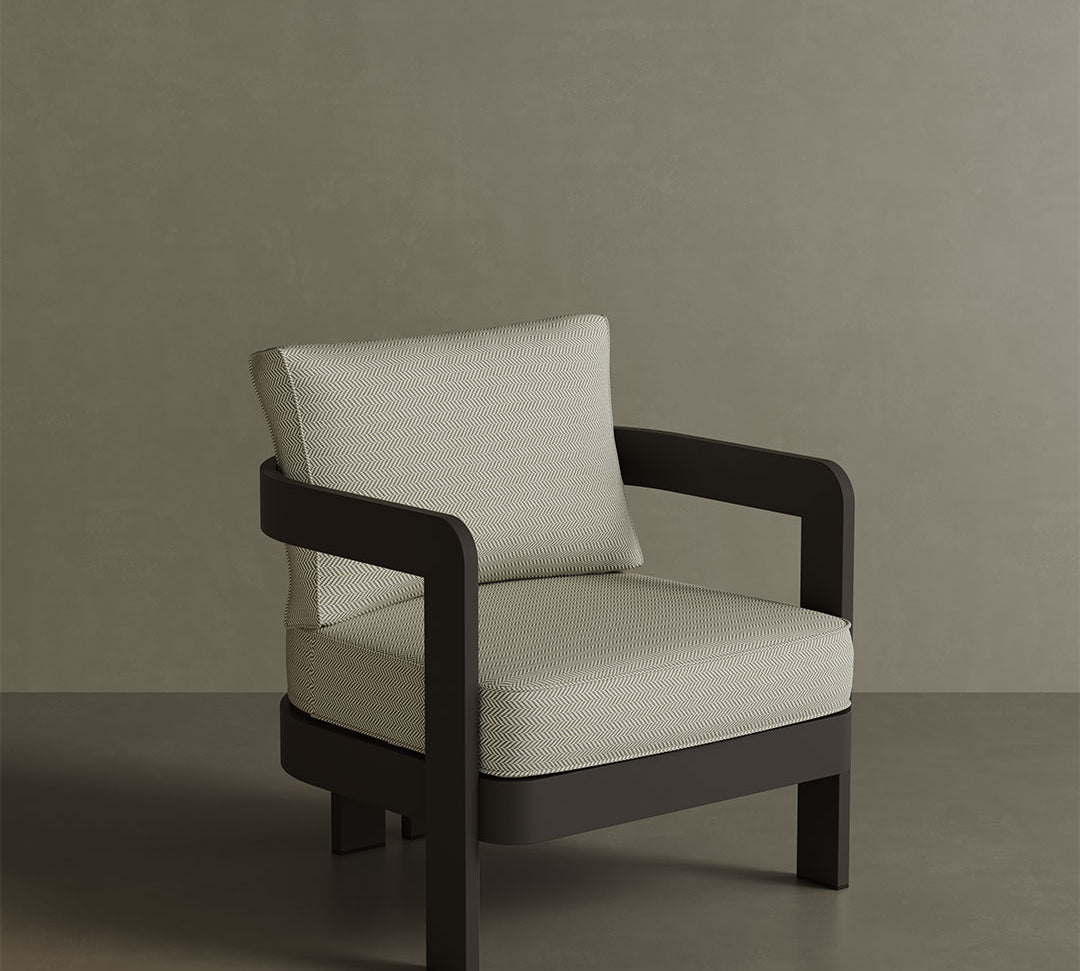 N3 Kohl Pearl Herringbone lounge chair, featuring soft, durable fabric in a refined pearl colour with a classic herringbone pattern. The chair is supported by a sleek aluminium frame, offering a stylish and comfortable design that suits both indoor and outdoor spaces.