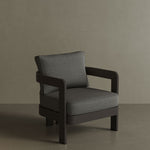 A modern N3 Kohl Smoke Weave lounge chair, featuring soft, durable fabric with a sophisticated smoke weave pattern. The sleek design and sturdy frame offer both comfort and contemporary style, making it an ideal addition to any outdoor or indoor lounge area. Its dark, neutral colour enhances the overall aesthetic, providing a refined and elegant touch.