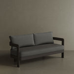 A luxurious three-seater sofa in Smoke Weave, featuring a modern, sophisticated design with soft, textured fabric. The sleek, contemporary lines and comfortable seating make it the perfect centrepiece for any outdoor space, offering both style and relaxation. Its versatile colour and premium construction ensure it blends seamlessly into a variety of outdoor settings.