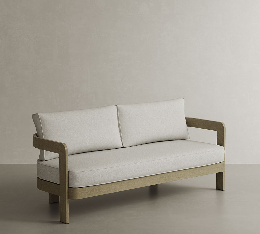 N3 Three-Seater Sofa in Bone Canvas, designed with a soft, resilient fabric in a creamy bone shade. Its sleek, minimalist frame highlights the clean lines and modern aesthetic, while the spacious cushions provide a comfortable seating experience, ideal for creating a relaxed yet stylish atmosphere in any room.