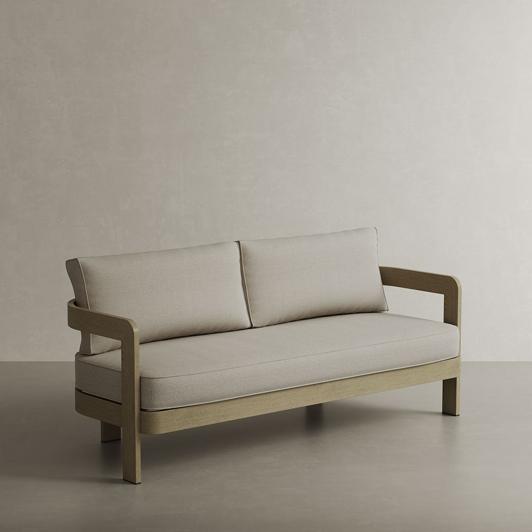 N3 Luxury Wood-Effect Aluminium Outdoor Sofa, featuring a high-quality aluminium frame with a realistic wood finish. The sofa is upholstered in soft sand-coloured outdoor fabric, accented with piping details for a sophisticated touch. Perfectly designed for durability and style, it adds both comfort and elegance to any outdoor living space.