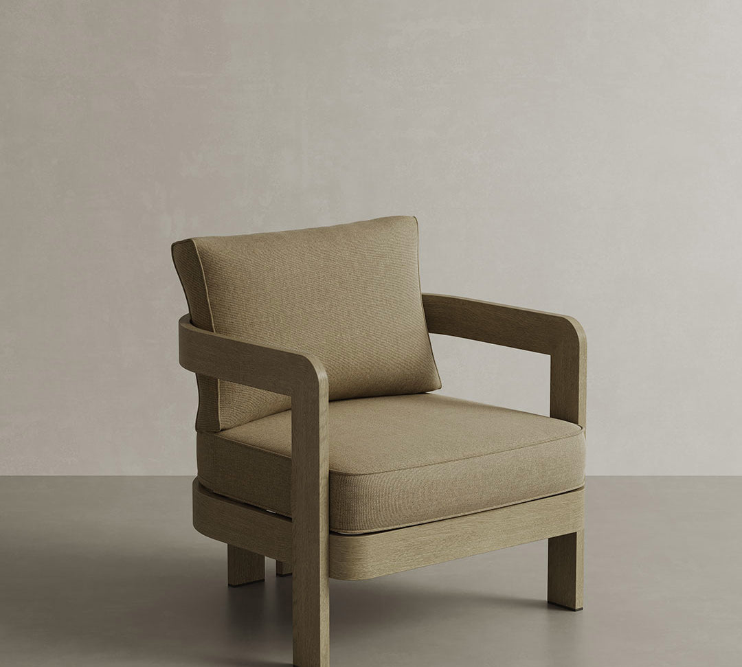 N3 Oak Lounge Chair in Wheat Canvas, featuring soft, durable fabric in a warm wheat tone. The chair is set against a stylish backdrop, highlighting its contemporary design with a sturdy oak frame, perfect for creating a comfortable and inviting atmosphere in any indoor or outdoor setting.