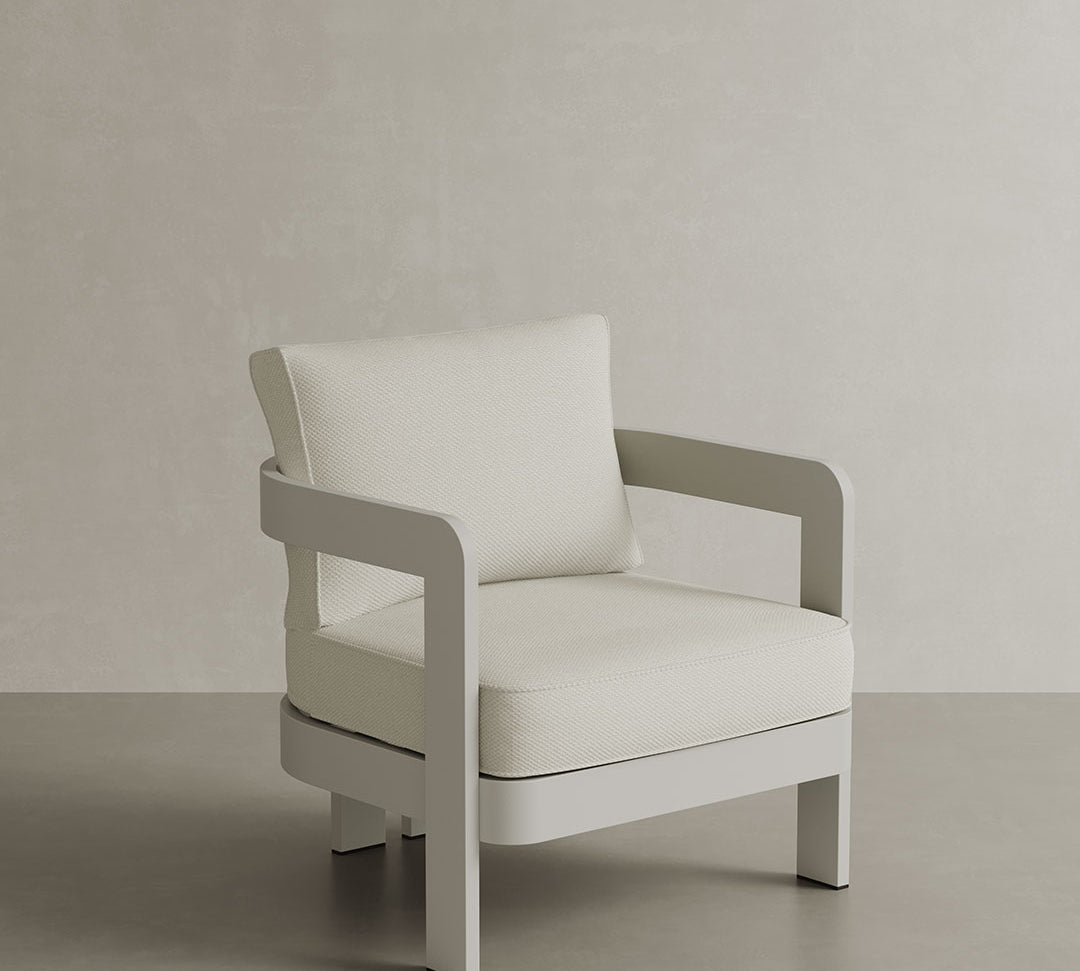 N3 Stone Cirrus Textured Weave lounge chair, featuring soft, durable fabric with a refined textured weave in a neutral stone colour. The chair is supported by a sleek aluminium frame, offering a modern design that combines comfort, elegance, and durability for both indoor and outdoor use.