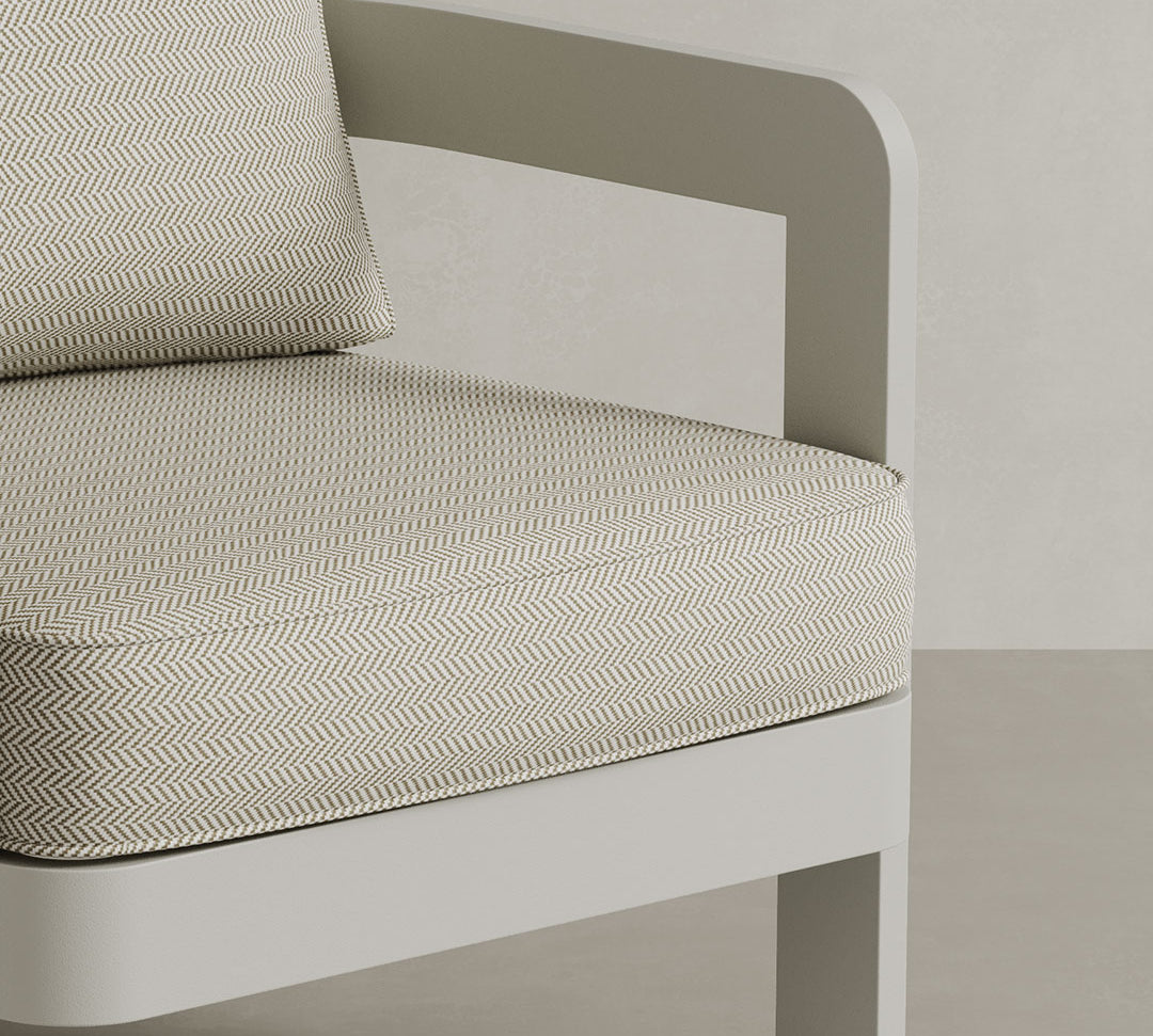 Close up of N3 Stone Lounge Chair with Pearl Herringbone fabric