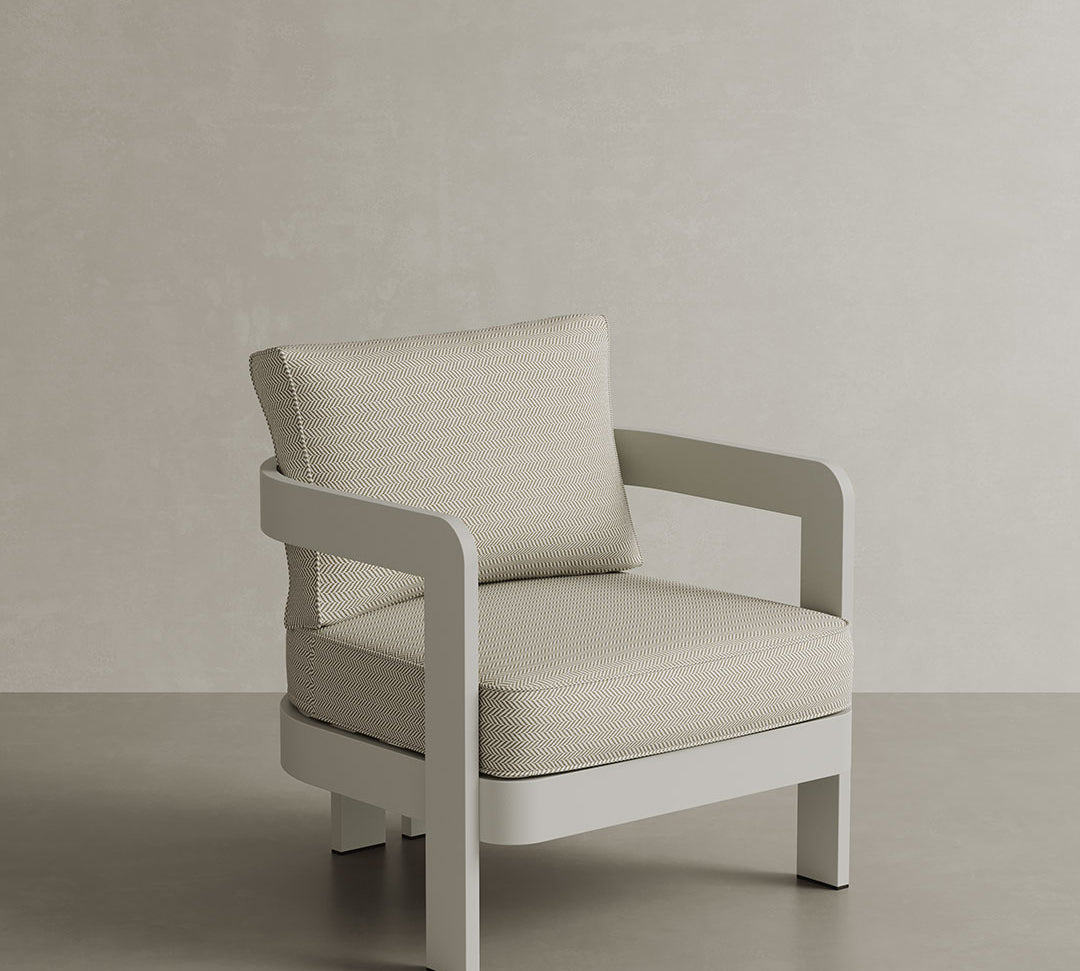 N3 Stone Pearl Herringbone lounge chair, featuring soft, durable fabric in a refined stone and pearl colour with a classic herringbone pattern. The chair is supported by a sleek aluminium frame, combining modern elegance with comfort, ideal for both indoor and outdoor spaces.