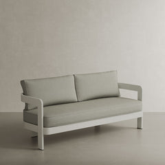 A refined N3 three-seater sofa in Stone Sage Twill, featuring soft, durable fabric with a blend of subtle stone and sage hues. The sleek aluminium frame adds a modern touch, ensuring both durability and elegance. Its neutral colour and contemporary design make it a versatile and sophisticated addition to any outdoor or indoor space.