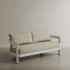 A modern N3 three-seater sofa in Stone Sand canvas, featuring soft, durable fabric and a sleek aluminium frame. The sofa’s neutral stone colour and contemporary design create a refined, versatile look, making it a perfect addition to any outdoor space, offering both comfort and timeless style.