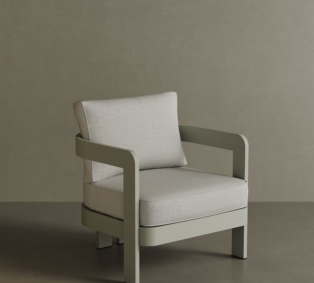 N3 Taupe Bone canvas lounge chair, featuring soft, durable fabric in a warm taupe bone colour. The chair is supported by a sleek aluminium frame, offering a modern design that combines comfort, elegance, and versatility for both indoor and outdoor spaces.