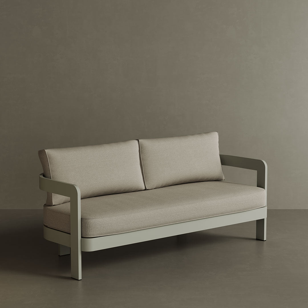A stylish N3 three-seater sofa in Taupe Sand canvas, showcasing a smooth, durable fabric with a minimalist design. The sofa’s subtle taupe shade and contemporary silhouette make it a perfect choice for enhancing any outdoor area. Built with a robust aluminium frame, it combines comfort and long-lasting elegance.