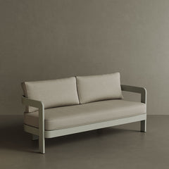 A stylish N3 three-seater sofa in Taupe Sand canvas, showcasing a smooth, durable fabric with a minimalist design. The sofa’s subtle taupe shade and contemporary silhouette make it a perfect choice for enhancing any outdoor area. Built with a robust aluminium frame, it combines comfort and long-lasting elegance.