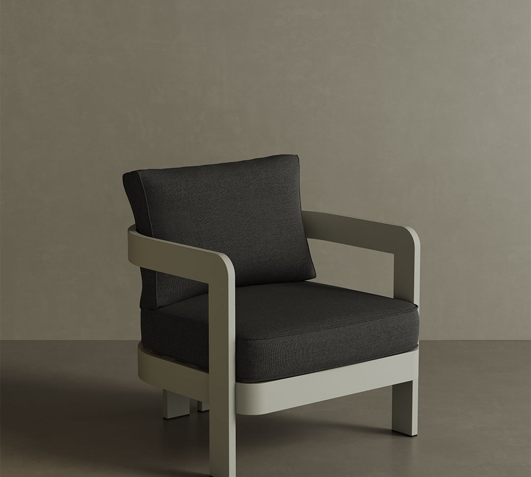 A contemporary N3 Taupe Shadow canvas lounge chair, featuring soft, durable fabric in a sophisticated taupe shade. The sleek aluminium frame provides both strength and style, while the minimalist design ensures comfort and modern appeal. Ideal for both indoor and outdoor spaces, its clean lines and neutral tone effortlessly complement any setting, adding a touch of elegance and versatility.
