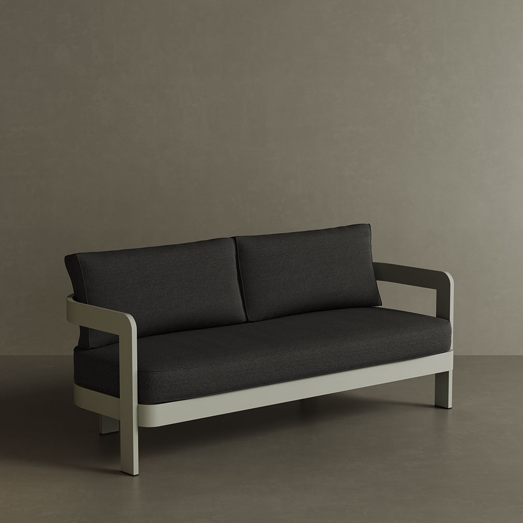 A refined N3 three-seater sofa in Taupe Shadow canvas, featuring a modern design with soft, durable fabric. The sofa is supported by a sleek aluminium frame, offering both elegance and durability. Its warm taupe colour and contemporary aesthetic make it a versatile addition to any outdoor space, providing comfort and a sophisticated touch.