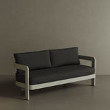 A refined N3 three-seater sofa in Taupe Shadow canvas, featuring a modern design with soft, durable fabric. The sofa is supported by a sleek aluminium frame, offering both elegance and durability. Its warm taupe colour and contemporary aesthetic make it a versatile addition to any outdoor space, providing comfort and a sophisticated touch.