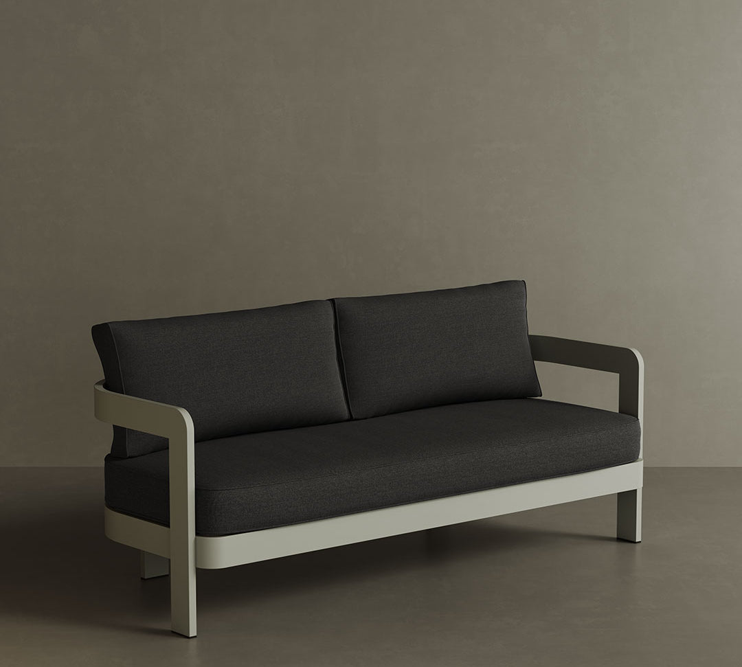 A refined N3 three-seater sofa in Taupe Shadow canvas, featuring a modern design with soft, durable fabric. The sofa is supported by a sleek aluminium frame, offering both elegance and durability. Its warm taupe colour and contemporary aesthetic make it a versatile addition to any outdoor space, providing comfort and a sophisticated touch.