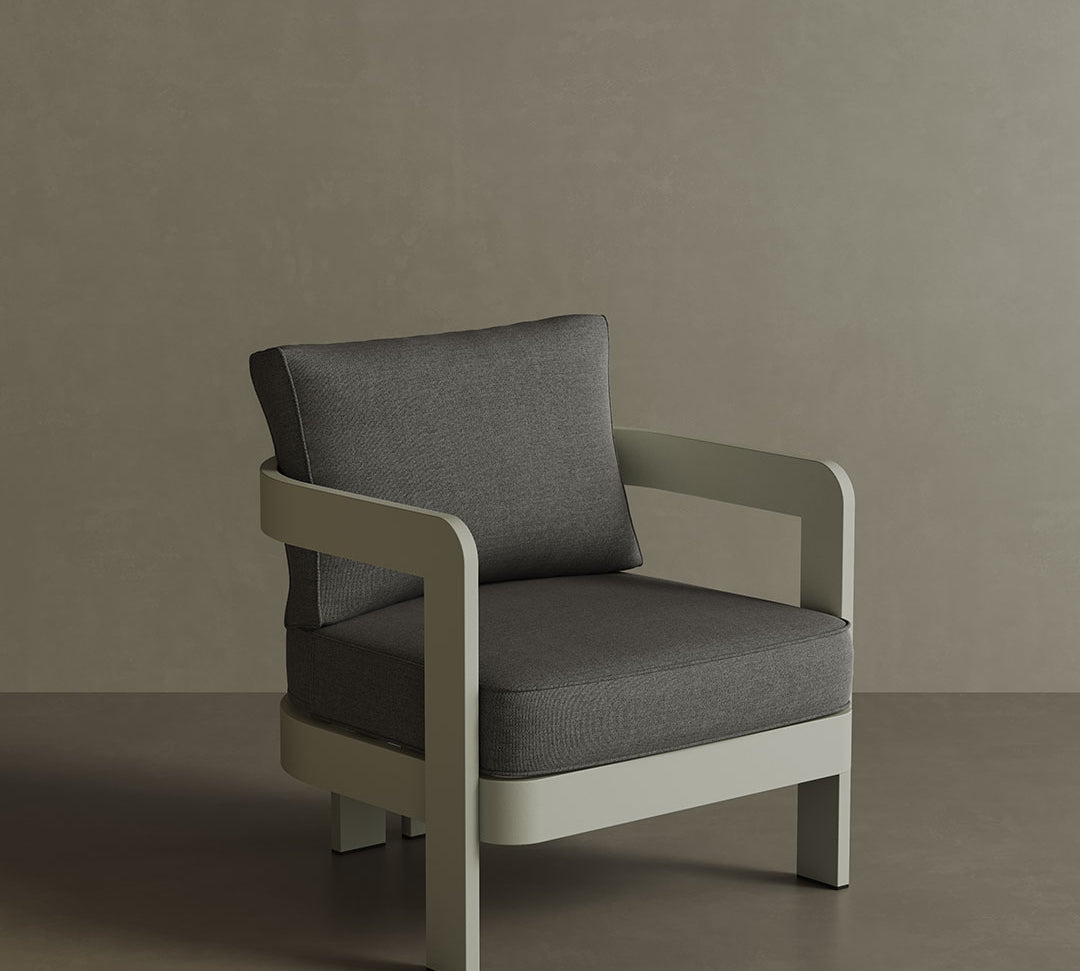 A stylish N3 Taupe Smoke Weave lounge chair, featuring soft, durable fabric with a refined smoke weave pattern. The sleek design and sturdy frame offer both comfort and contemporary elegance, making it a perfect addition to any outdoor or indoor lounge space. Its warm taupe colour adds a sophisticated touch to the overall aesthetic.