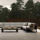 N5 sofa black powder-coated aluminium frame with teak detail lifestyle image