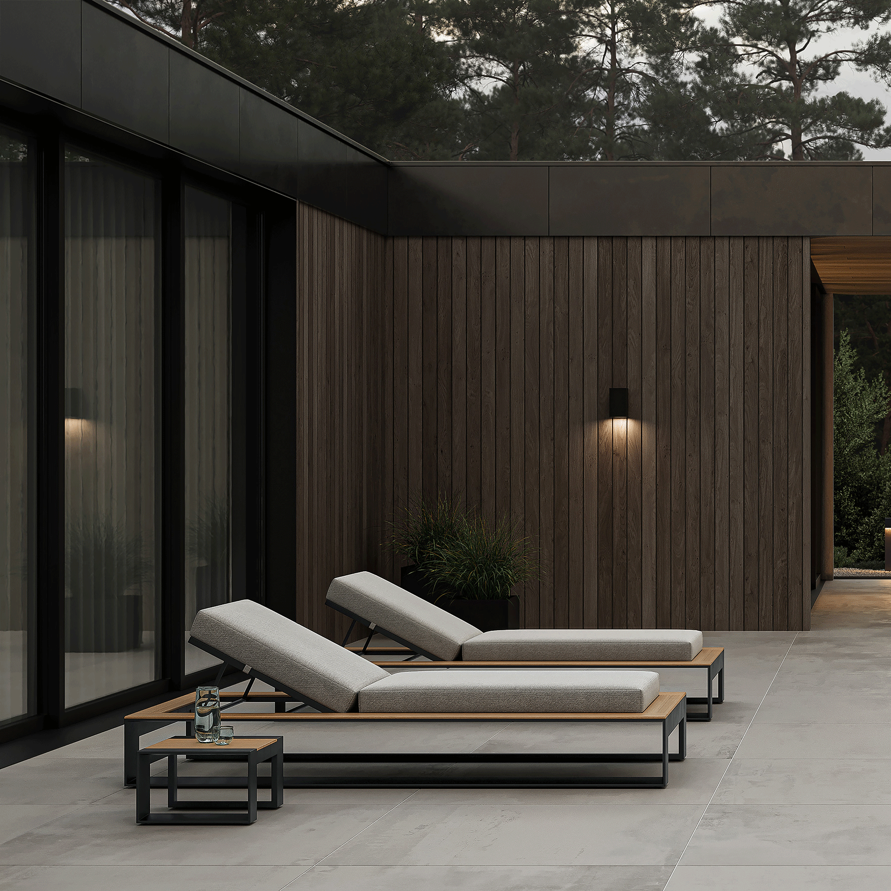 N5 sun lounger black powder-coated aluminium frame with teak detail lifestyle imagine