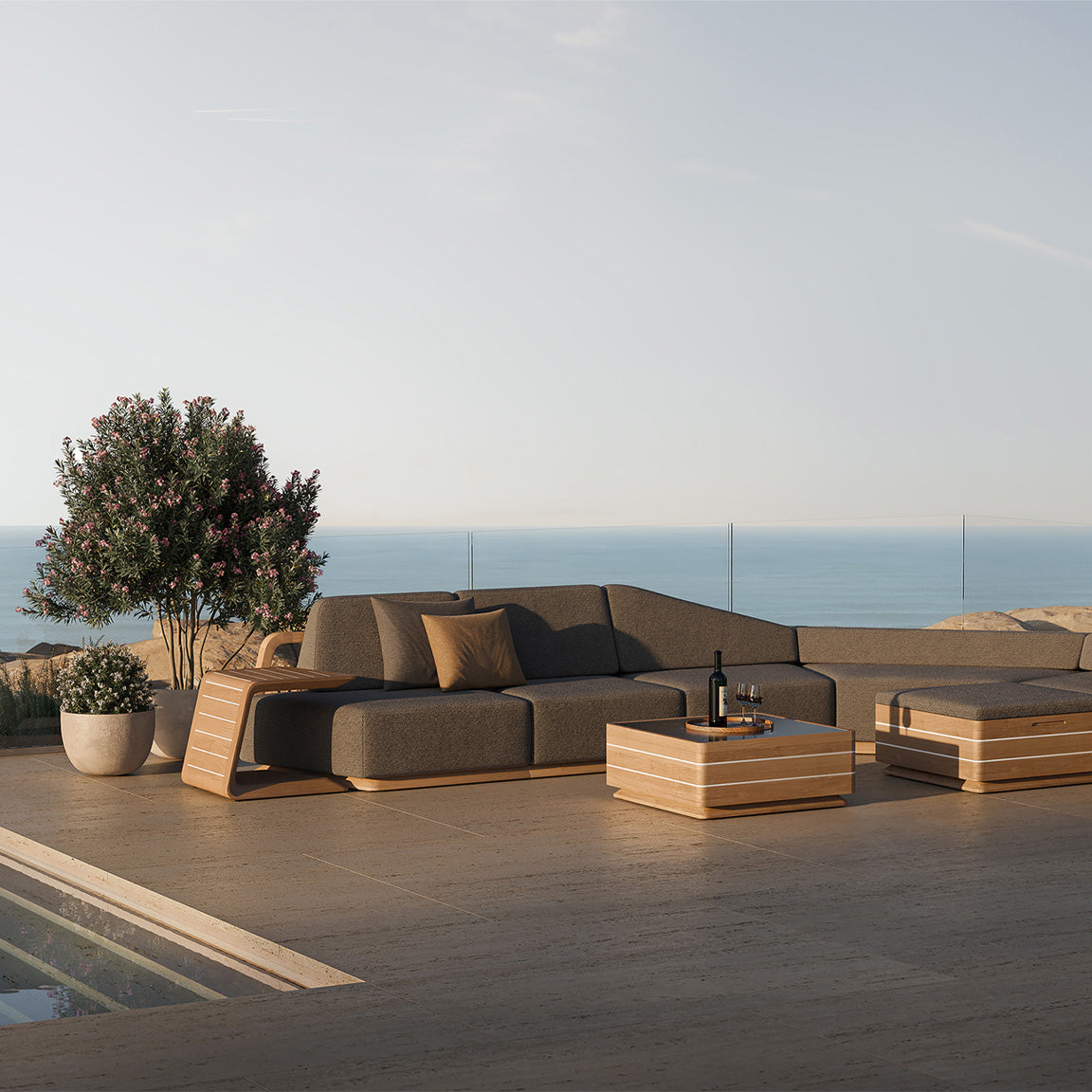 N6 dark corner sofa with coffee table lifestyle image of luxury outdoor living