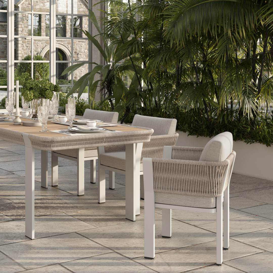 N7 luxury beige outdoor furniture with rope teak and aluminium detail with garden dining table and chairs in orangery