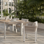 N7 luxury beige outdoor furniture with rope teak and aluminium detail with garden dining table and chairs in orangery